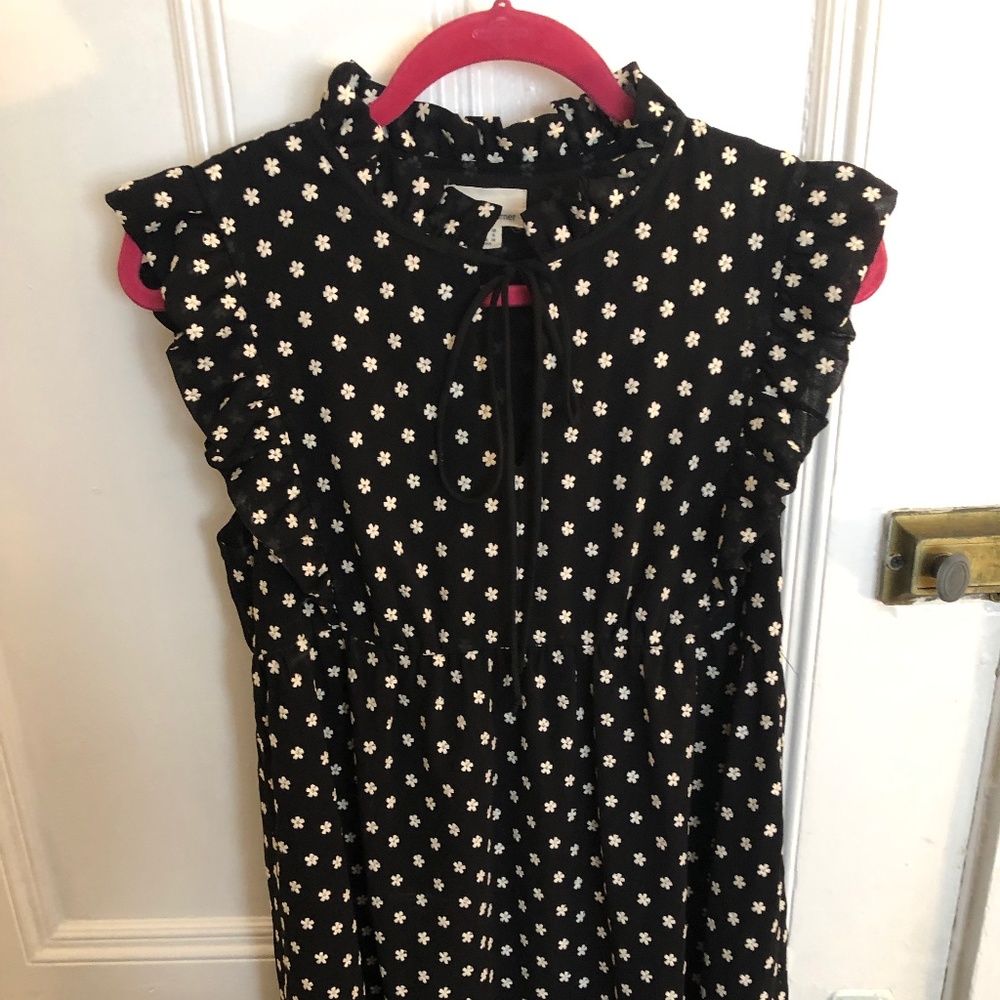 The Korner black knee length dress with white hand stitched floral pint, size 8